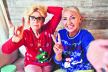 glavna-stockphotohardrocktwoseniorstylishwomenwearingchristmassweatshirtsshowingpeaceandhardrock1845316558.jpg