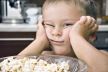 stockphotobabyboyisposingafacenearthebowlofpopcornonakitchenequipmentbackground313631642.jpg