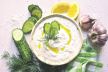 stock-photo-tzatziki-traditional-greek-yogurt-sauce-in-a-bowl-on-a-white-slate-stone-or-concrete-background-1633485067.jpg