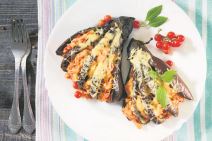 stockphotobakedeggplantwithcheesetomatoesandchickenonadarkwoodentabletopview315288311.jpg