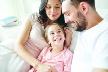 stockphotopeoplefamilyandmorningconcepthappychildwithparentsinbedathome647806825.jpg