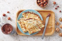stockphotohomemadecrepestastythinpancakeswithchocolateandnuts1489930856.jpg
