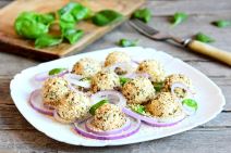 stockphotosmallcheeseballsonaplatecreamcheeseballswithdriedherbsandroastedsesameseedsserved583280848.jpg