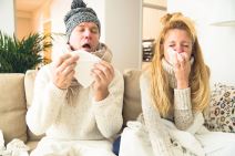 stockphotosickcouplecatchcoldmanandwomansneezingcoughingpeoplegotfluhavingrunnynose511842424.jpg