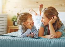 6---stockphotohappyfamilymotherandchilddaughterplayandlaughinginbed767699113.jpg