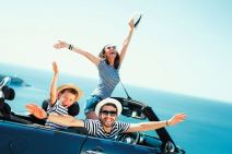 stockphotohappyfamilytravelbycartotheseapeoplehavingfunincabrioletsummervacationconcept1131304607.jpg