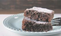 stockphotopairofstackedbrowniesonablueplatewithafork1771619978.jpg