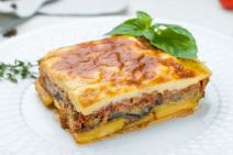 stock-photo-eggplant-moussaka-greek-cuisine-on-white-plate-on-white-concrete-table-1937801719.jpg