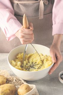 GLAVNA stock-photo-woman-making-mashed-potato-at-light-grey-table-closeup-2258568047.jpg