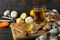 stock-photo-concept-of-treatment-colds-with-honey-and-garlic-on-wooden-table-2097496672.jpg