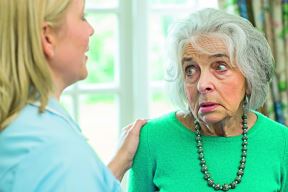 stockphotocareworkertalkingtodepressedseniorwomanathome1107628469.jpg