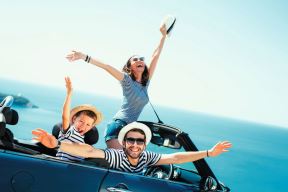 stockphotohappyfamilytravelbycartotheseapeoplehavingfunincabrioletsummervacationconcept1131304607.jpg