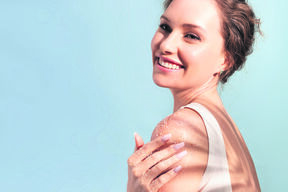 stock-photo-a-beautiful-tender-woman-put-a-natural-cosmetic-scrub-to-her-shoulder-and-smiles-2218212193.jpg