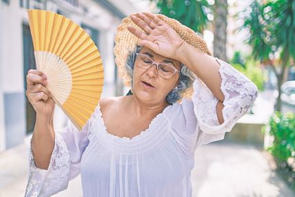 glavna-stockphotomiddleagewomanwithgreyhairusinghandfanonaveryhotdayofaheatwave1922332205.jpg