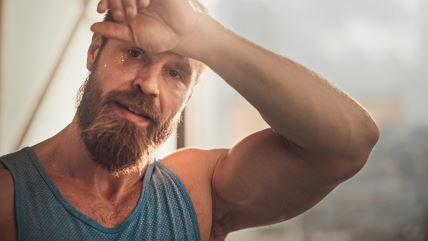 znojenje-stockphotoportraitofstrongbeardedmaleathletewearingsleevelessshirtwipessweatfromhisforeheadwith1720291450.jpg
