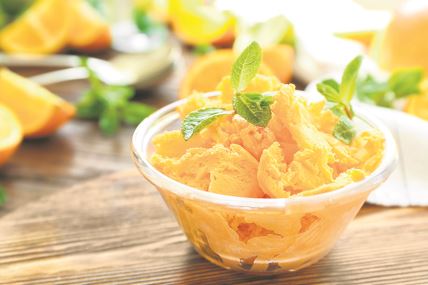 stockphotoglassbowlwithdeliciouscitrusicecreamonwoodenboard641650270.jpg