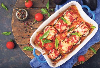 stockphotoeggplantauberginerollswithmeatintomatosauceflatlaytopview709414288.jpg