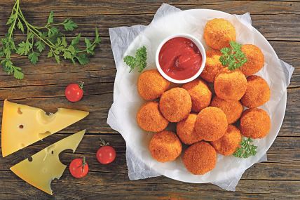 stockphotopotatocroquettesmashedpotatoesballsbreadedanddeepfriedservedwithketchuponplateon758495518.jpg