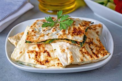 stockphototraditionalturkishfoodturkishpancakegozlemewithcheeseandherbtheappetizeristurkish2196415069.jpg