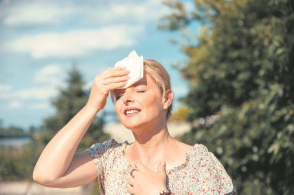 glavna--stockphotoportraitofblondeprettywomanhavinghotflashandsweatingonsunheatatsummerdayoutdoors2165388153.jpg