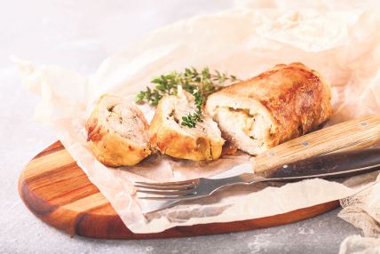stockphotochickenrollandvegetablesonatableselectivefocuscopyspace580320742.jpg