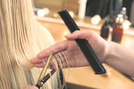 tanka-kosa---stockphotohairdressercuttingclientshairwithscissorsinsaloncloseup2437281849.jpg