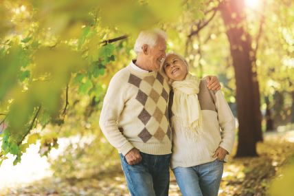 stockphotoelderlycoupleembracinginautumnpark1230543616.jpg