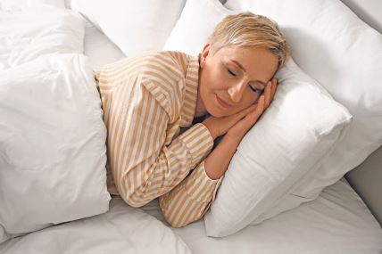 stockphotomaturewomansleepinginbed2345809449.jpg