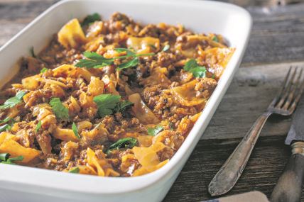 stockphotocasserolewithmincedmeatandcabbageonrusticandwoodentable2033771714.jpg