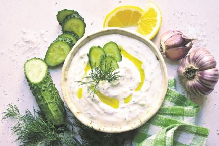 stock-photo-tzatziki-traditional-greek-yogurt-sauce-in-a-bowl-on-a-white-slate-stone-or-concrete-background-1633485067.jpg