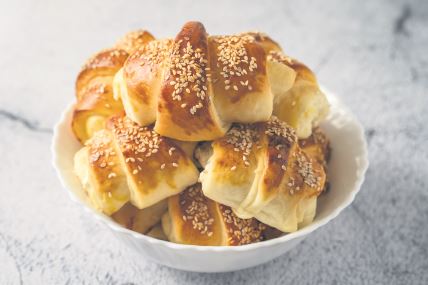 stock-photo-close-up-on-homemade-cheese-croissants-in-ceramic-bowl-on-the-marble-table-homemade-snack-for-1869421354.jpg