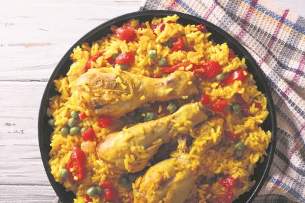 stock-photo-spanish-paella-with-chicken-and-vegetables-close-up-on-a-plate-horizontal-view-from-above-324405815.jpg