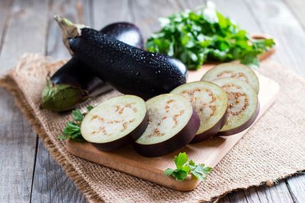 GLAVNA  stock-photo-sliced-eggplant-on-wooden-cutting-board-693208924.jpg