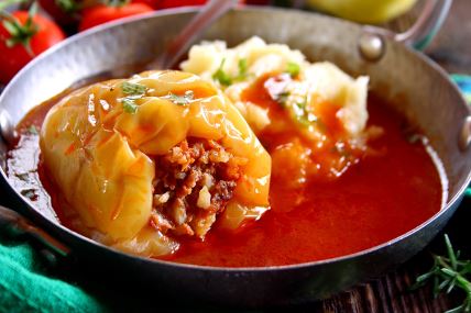 stock-photo-stuffed-peppers-with-ground-meat-and-rice-in-tomato-sauce-2488971037 (1).jpg