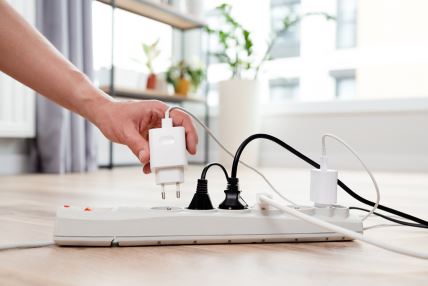 stock-photo-electrical-plug-in-outlet-socket-at-home-energy-efficiency-concept-2326478597.jpg