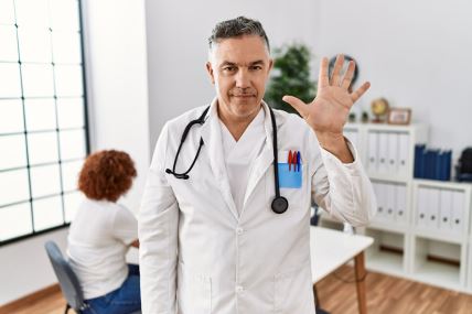 GLAVNA  stock-photo-middle-age-doctor-man-at-the-clinic-with-a-patient-showing-and-pointing-up-with-fingers-number-five-2027448629.jpg
