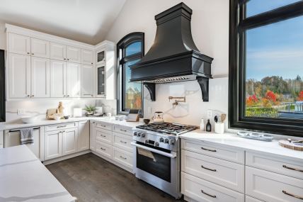 stock-photo-huge-spacious-luxury-kitchen-staged-clock-beam-ceiling-dark-hardwood-slate-flooring-white-cabinet-2597177527.jpg