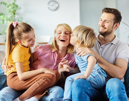 stock-photo-family-having-fun-playing-on-sofa-at-home-2074523137.jpg