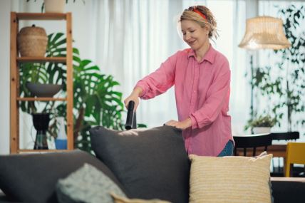 TEPISI I MEBL  stock-photo-smiling-housewife-using-handheld-vacuum-cleaner-to-remove-dust-and-mites-from-sofa-in-living-room-2590840969.jpg