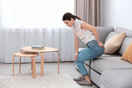 NEUDOBAN KAUC   stock-photo-young-woman-suffering-from-hemorrhoid-on-sofa-at-home-1637957935.jpg