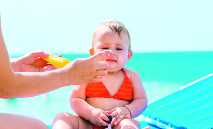 NA PLAZU UJUTRO ILI PREDVECE  stock-photo-mother-puts-sunscreen-on-baby-selective-focus-child-2328281799.jpg