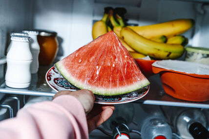 GLAVNA  stock-photo-closeup-of-a-man-moving-a-plate-with-plastic-wrapped-watermelon-deeper-onto-a-refrigerator-shelf-2777620855.jpg