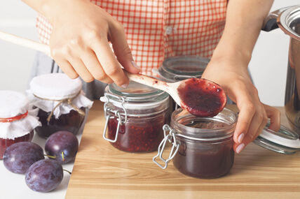 GLAVNA  stock-photo-woman-tasting-homemade-marmalade-with-plums-165645110.jpg