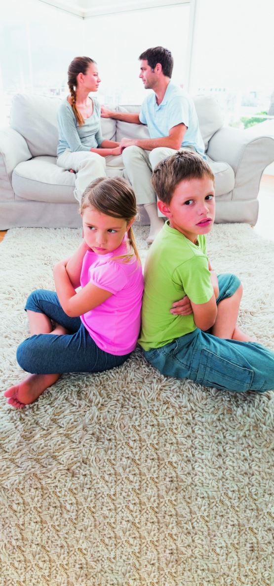 stockphotopoutingsiblingssittingbacktobackwhileparentsarearguingathomeinthelivingroom186128966-copy.jpg