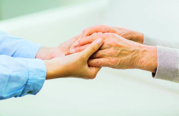 stockphotopeopleagefamilycareandsupportconceptcloseupofseniorandyoungwomanholdinghands324365039.jpg