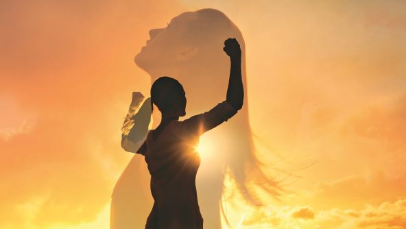stockphotostrongwomanwinningsuccessandlifegoalsconceptyoungwomanwitharmsflexedlookingupto1614362578.jpg