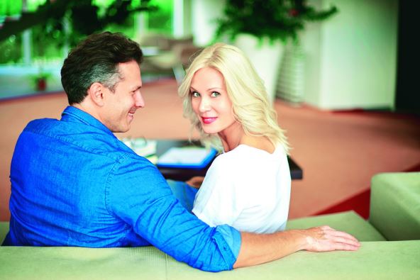 stockphotoshotofalovelymaturecouplerelaxingtogetherrearviewshotofamaturemansittingoncouch523820653.jpg