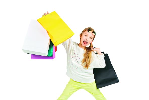 stockphotogirlishavingfunwithalotofshoppersbags626584328.jpg
