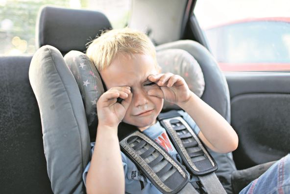 stockphotopreschoolcuteyearsoldboysittinginsafetycarseatandcryingduringfamilytravelbycar1409968886.jpg