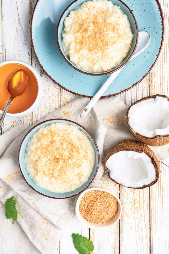 stockphotosweetandcreamycoconutricepuddingwithhoneytoppedwithgratedandtoastedcoconutina1941211123.jpg